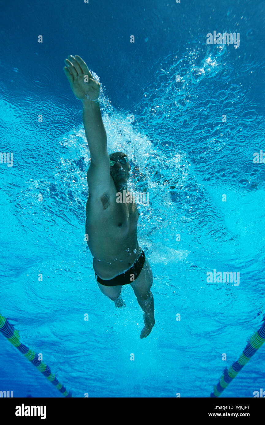 Male swimmer in pool, underwater view Stock Photo
