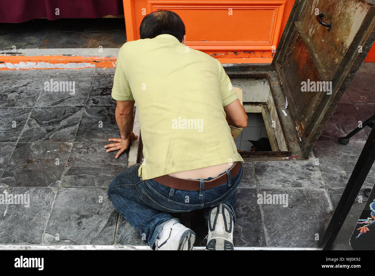 Kneeling Man Rear View High Resolution Stock Photography and Images - Alamy