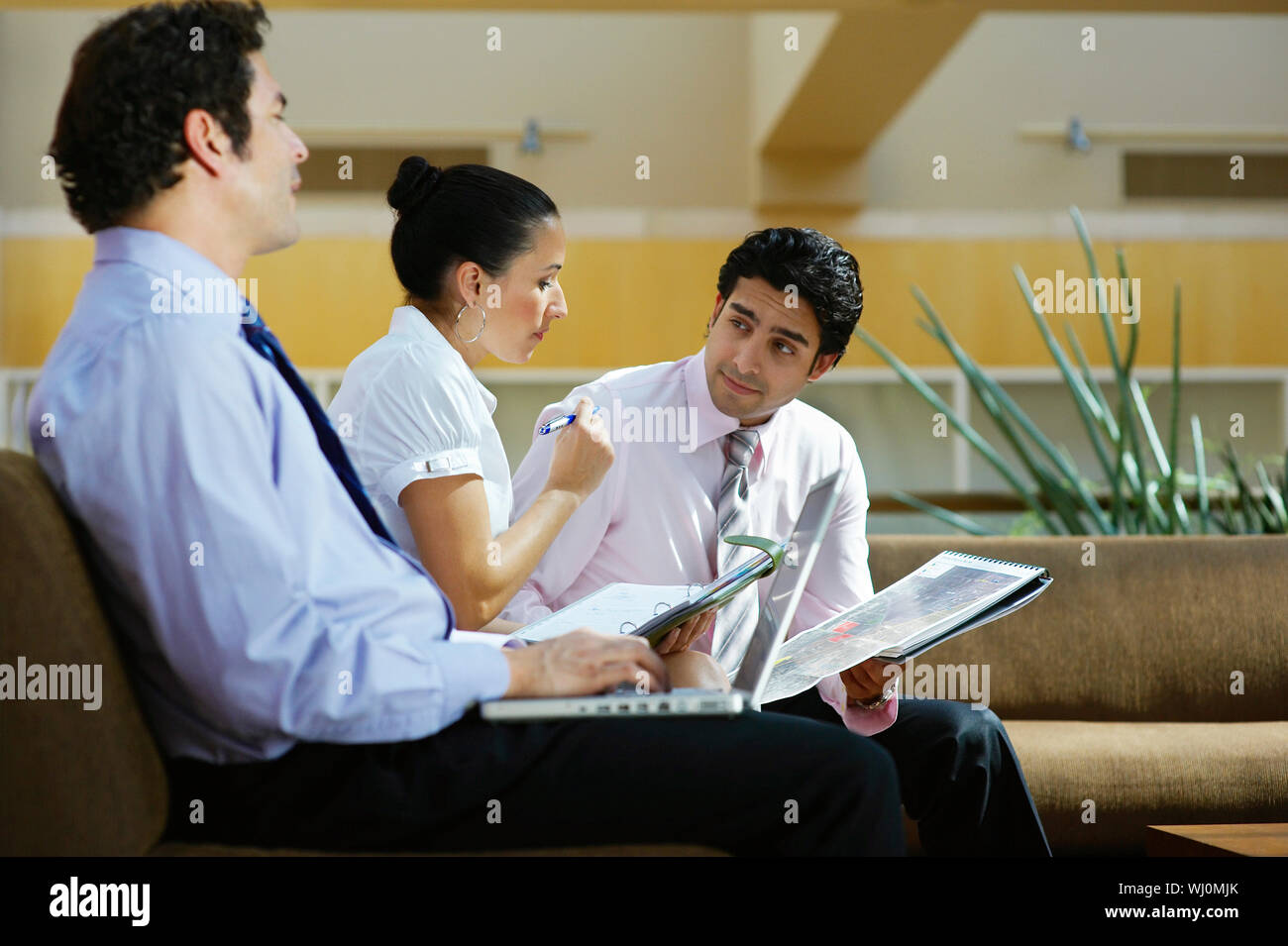 Young business people working in office Stock Photo - Alamy