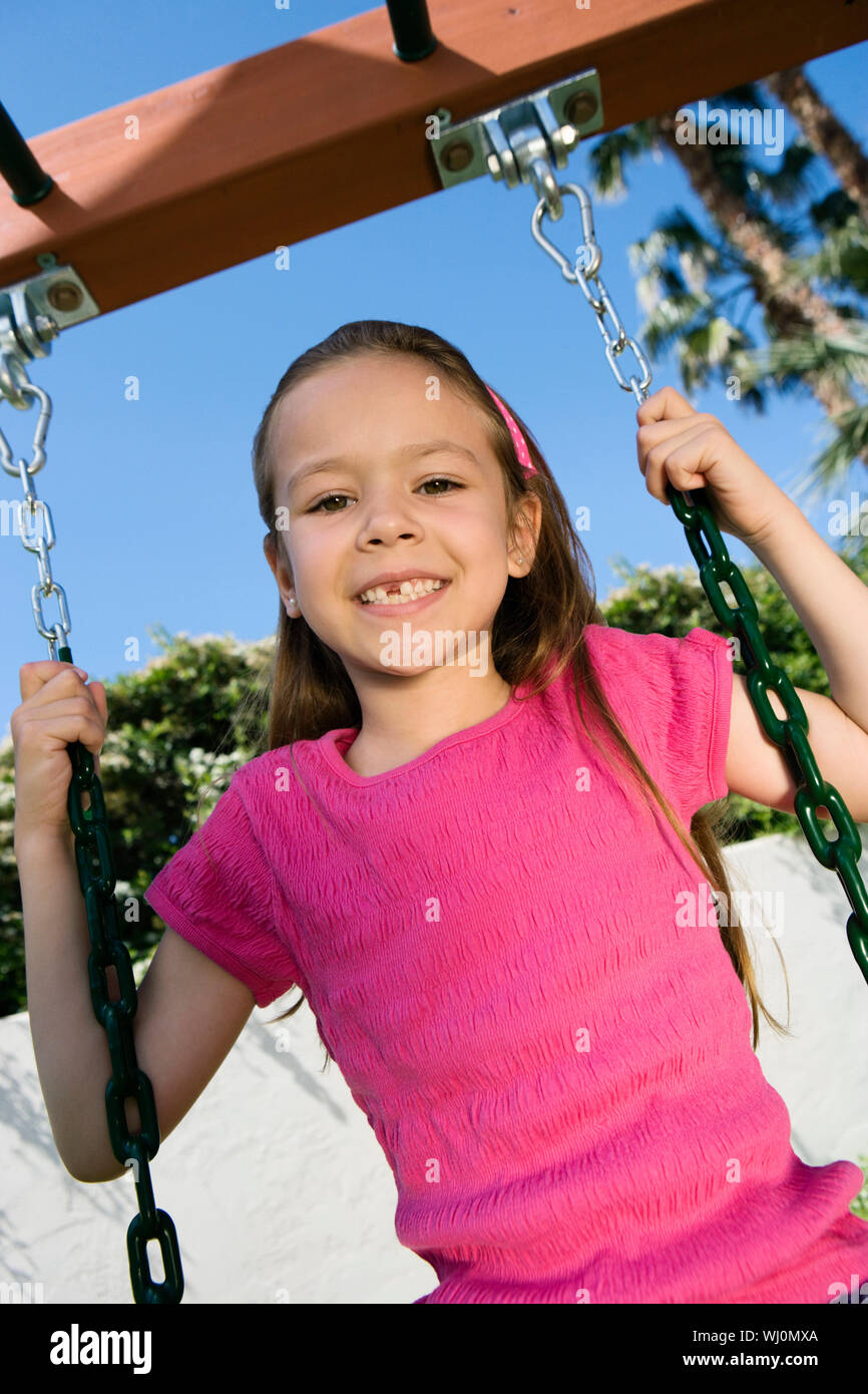 Little Girl Swinging Stock Photo Alamy