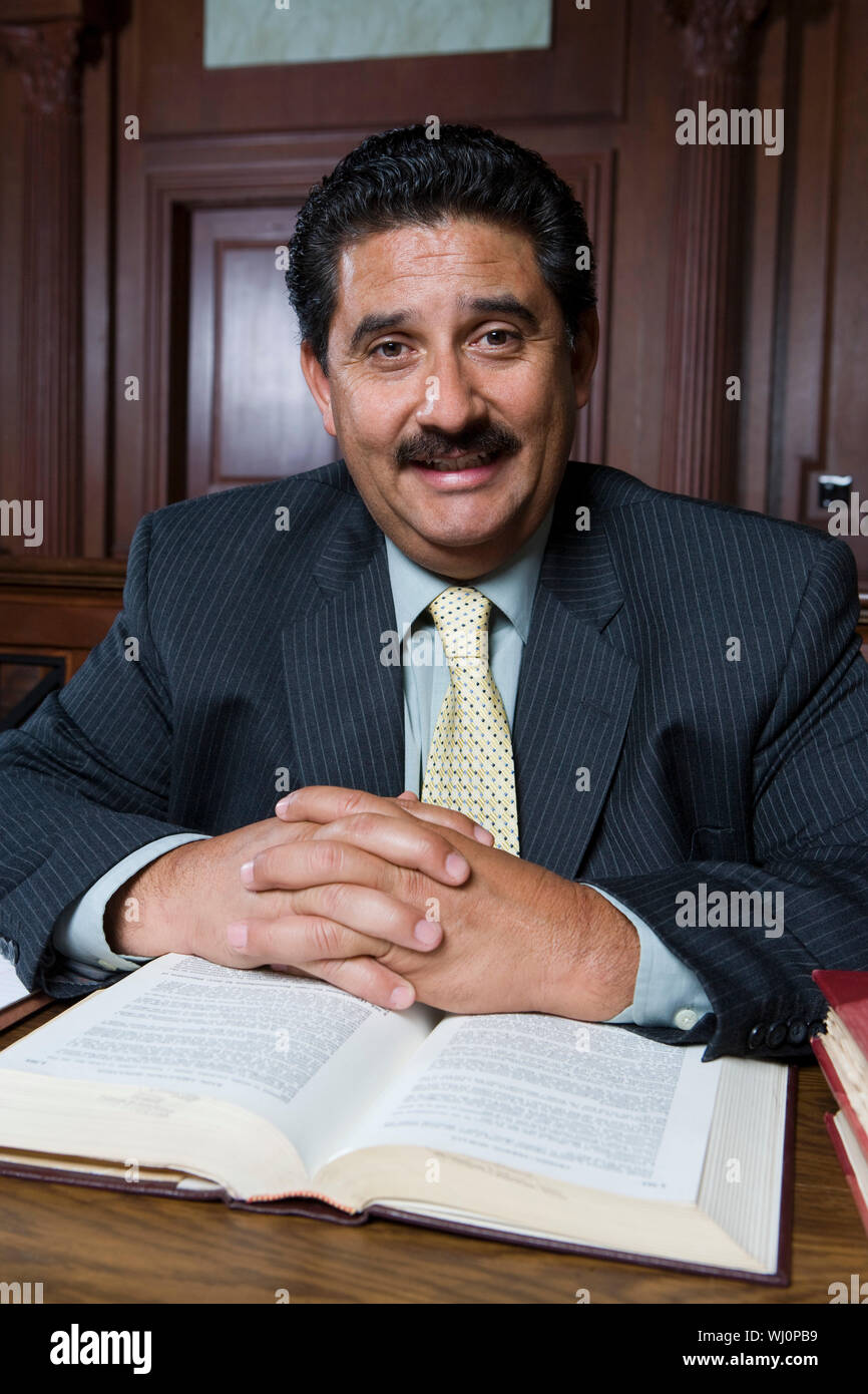 Man sitting in court, portrait Stock Photo Alamy