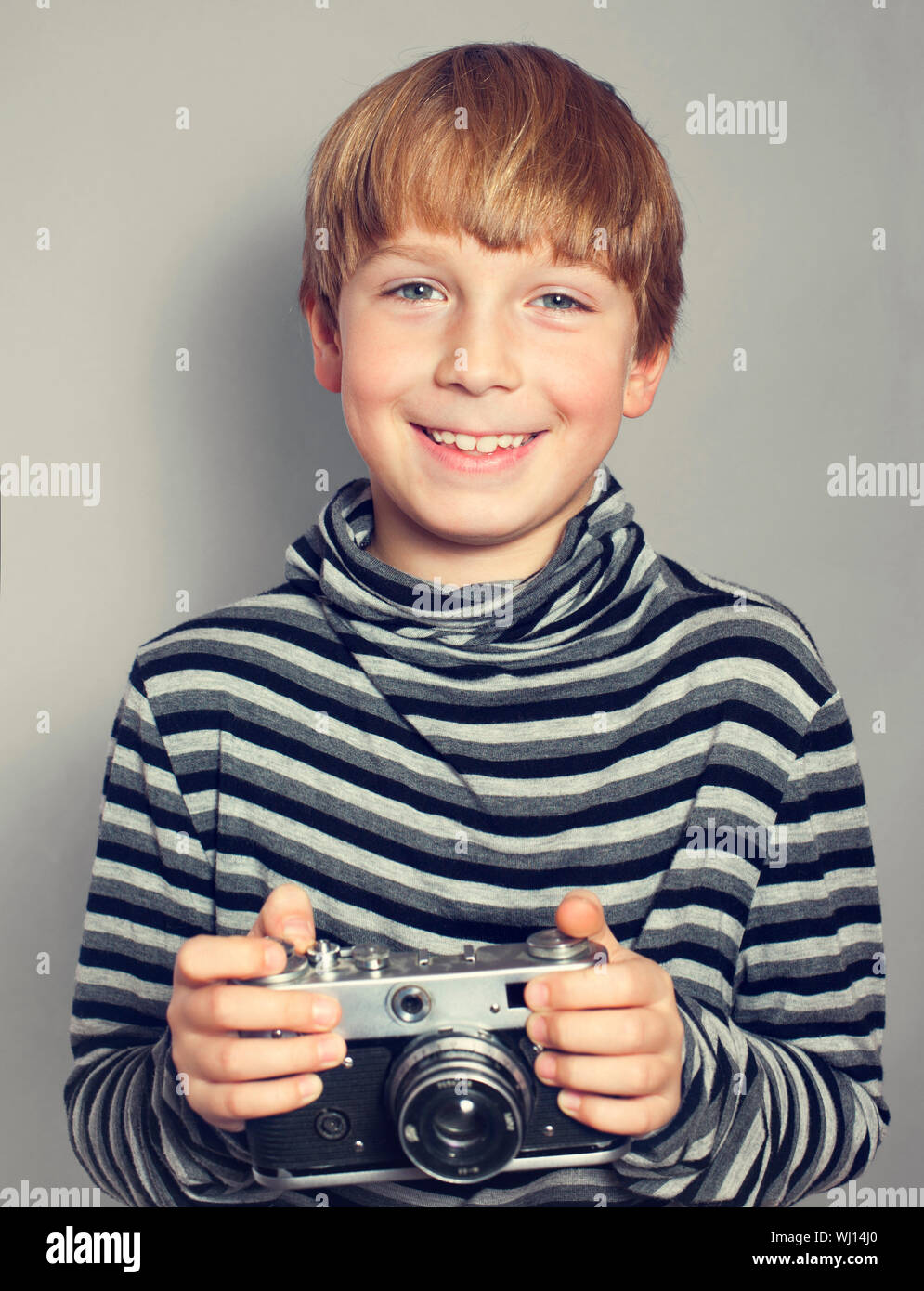handsome boy with an old camera Stock Photo
