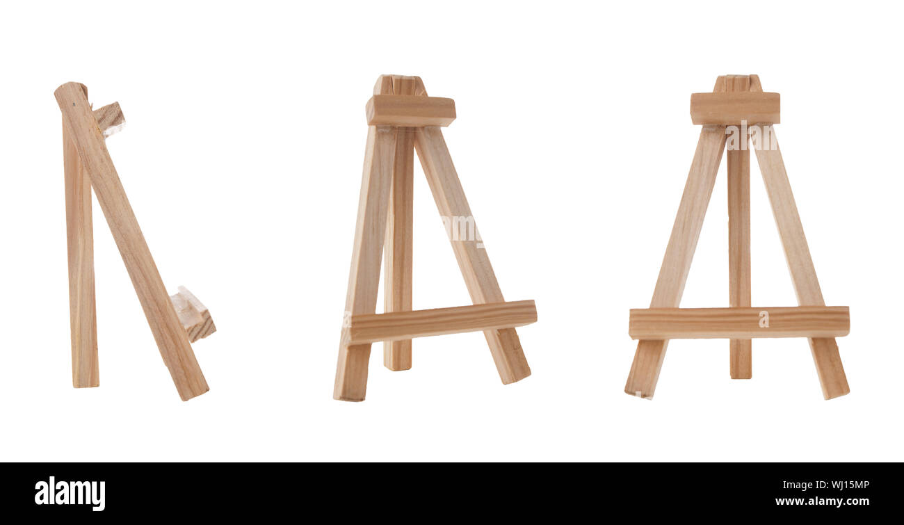 Small easel with white blank cloth on a wooden table. Miniature painting  accessories. Light background Stock Photo - Alamy