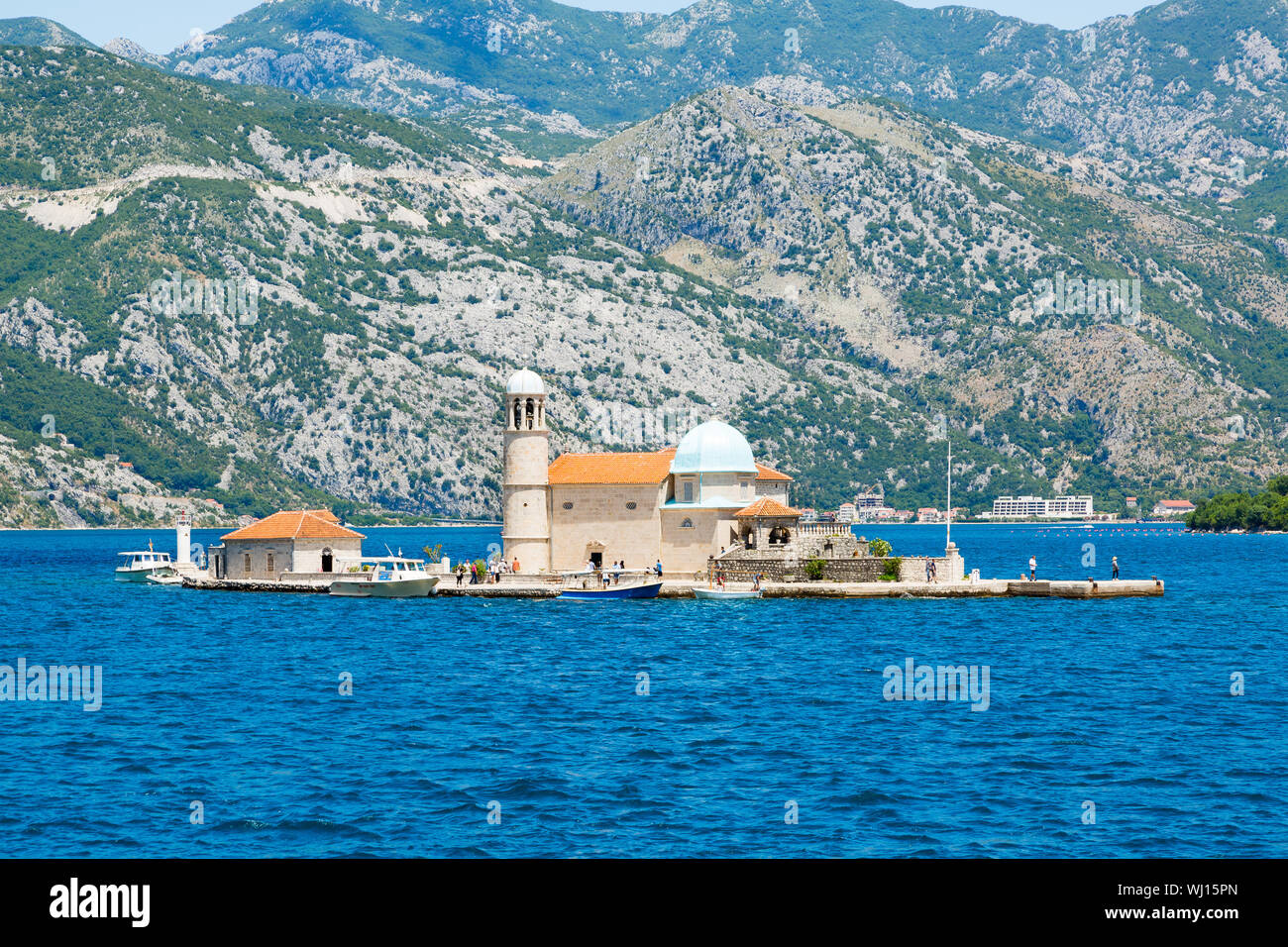 Our Lady Of The Rock Monastery On Shaw Island Against Mountains Stock