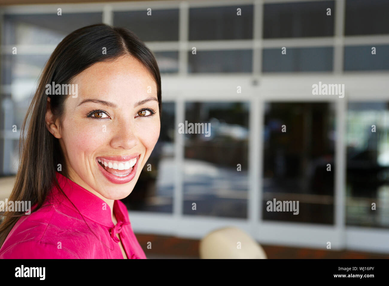 Closeup portrait of a cheerful Asian woman Stock Photo - Alamy