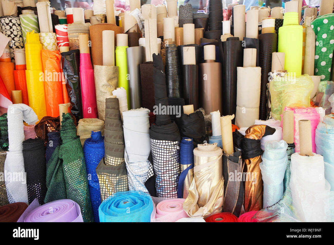 Closeup of various fabric bolts in store Stock Photo Alamy