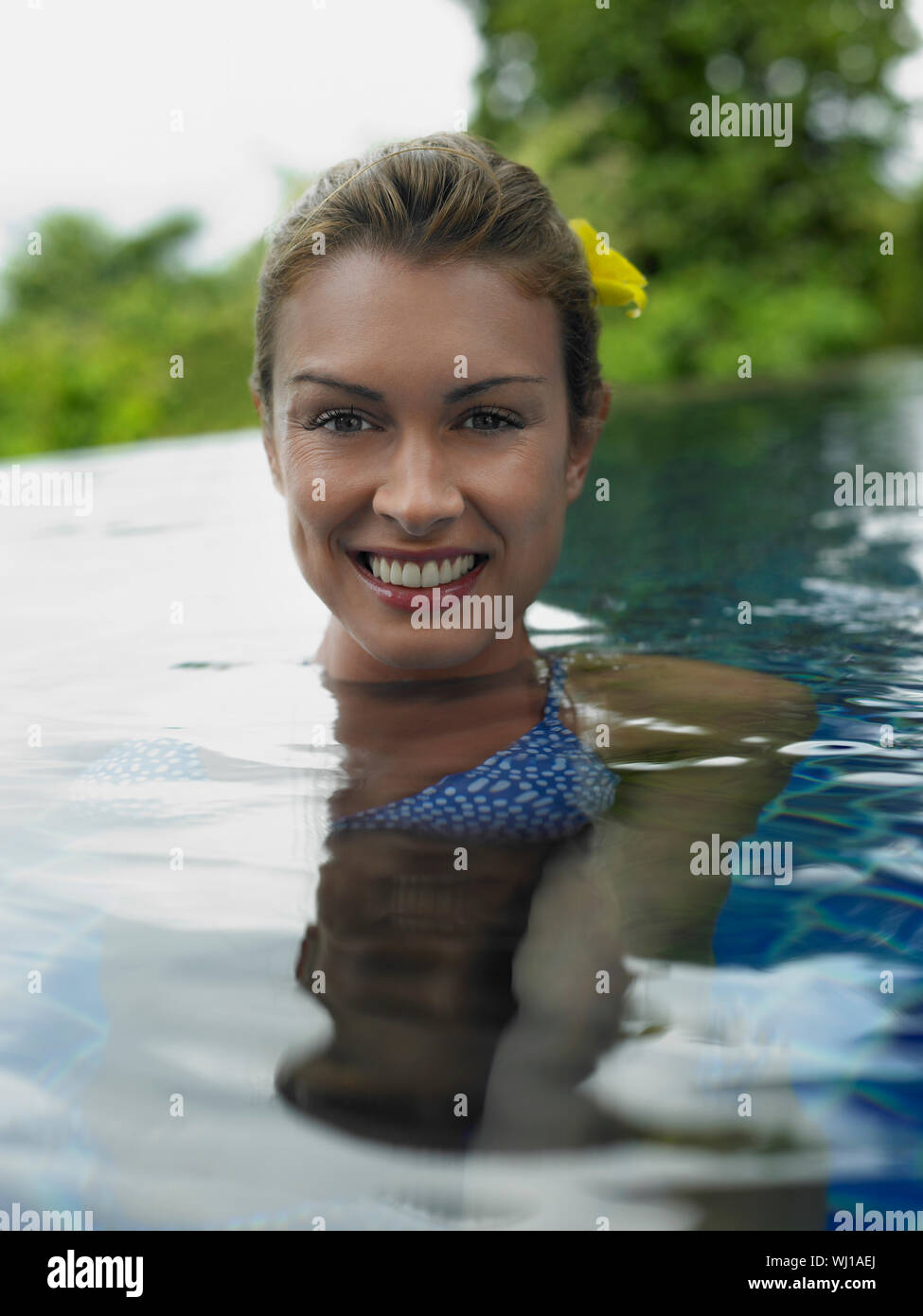 Closeup portrait of a smiling young woman in the swimming pool Stock ...