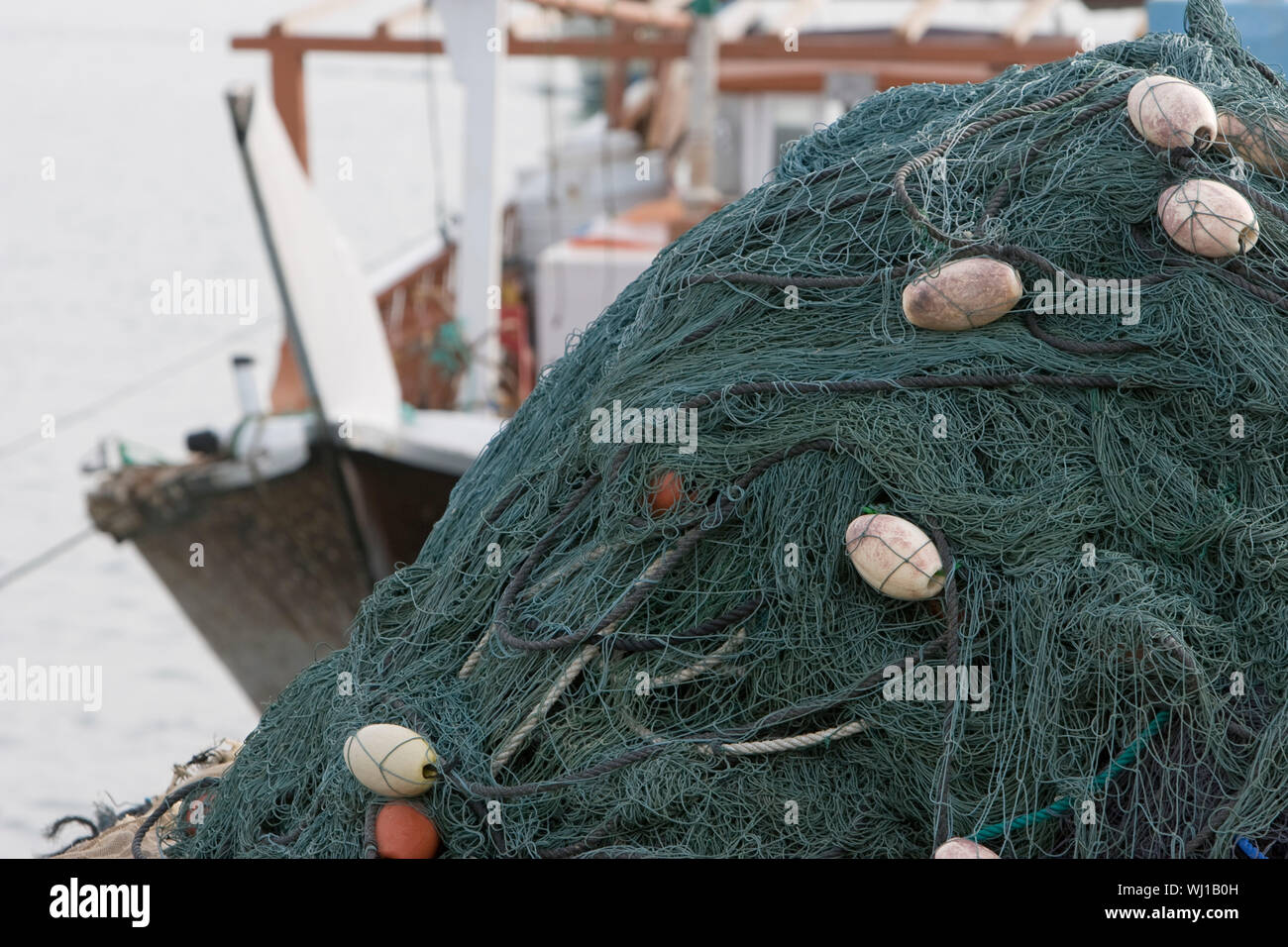 Kalba, UAE, Fishing nets piled high on boat in Kalbar Fujairah Stock