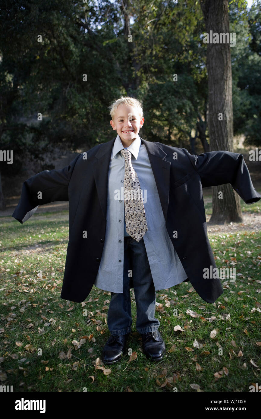 Child wearing suit too big hi-res stock photography and images - Alamy