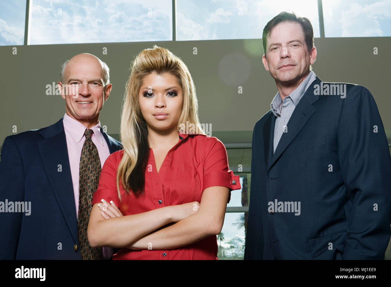 Portrait of three confident multiethnic businesspeople Stock Photo