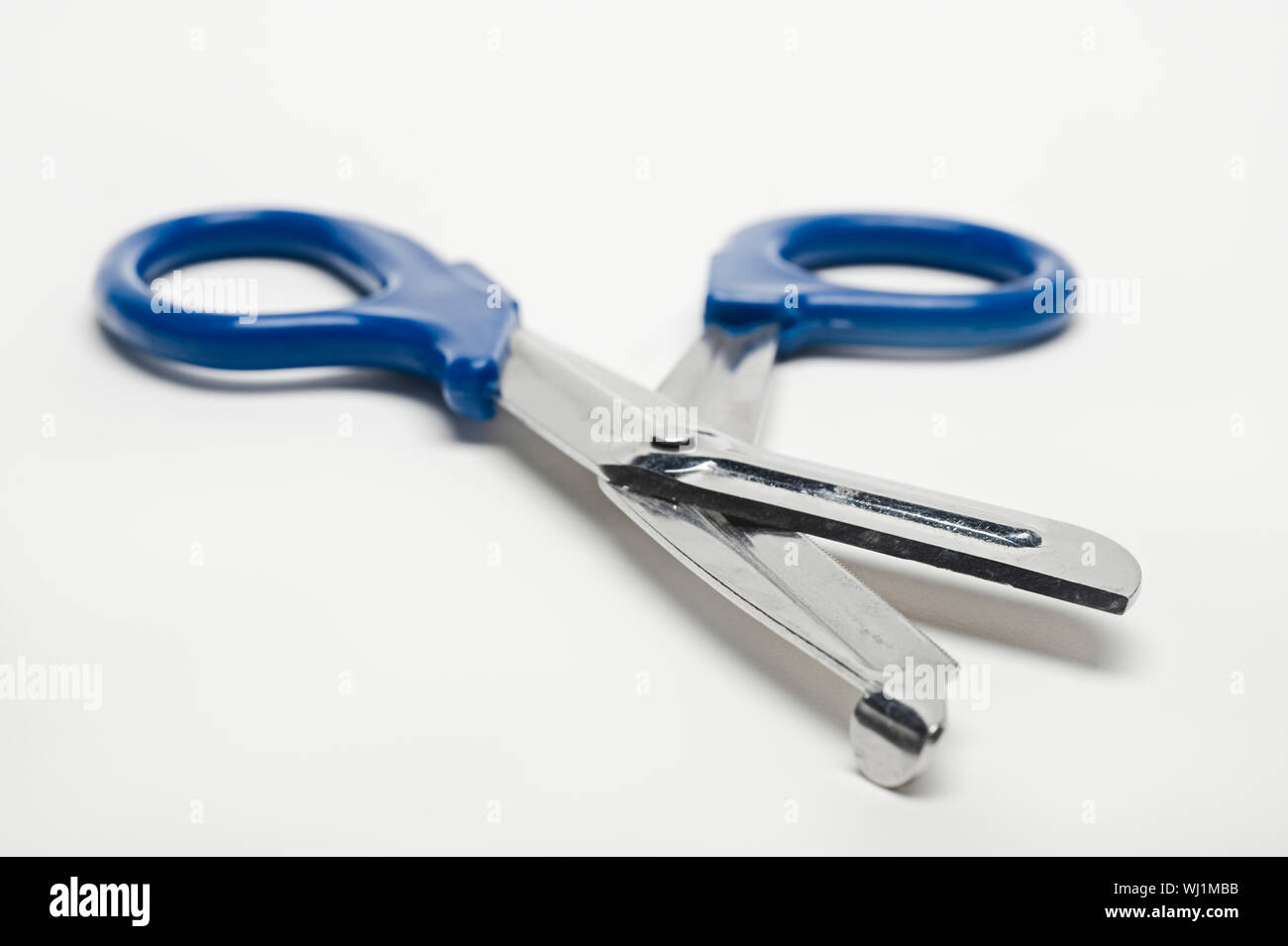 Medical scissors isolated over white background Stock Photo - Alamy