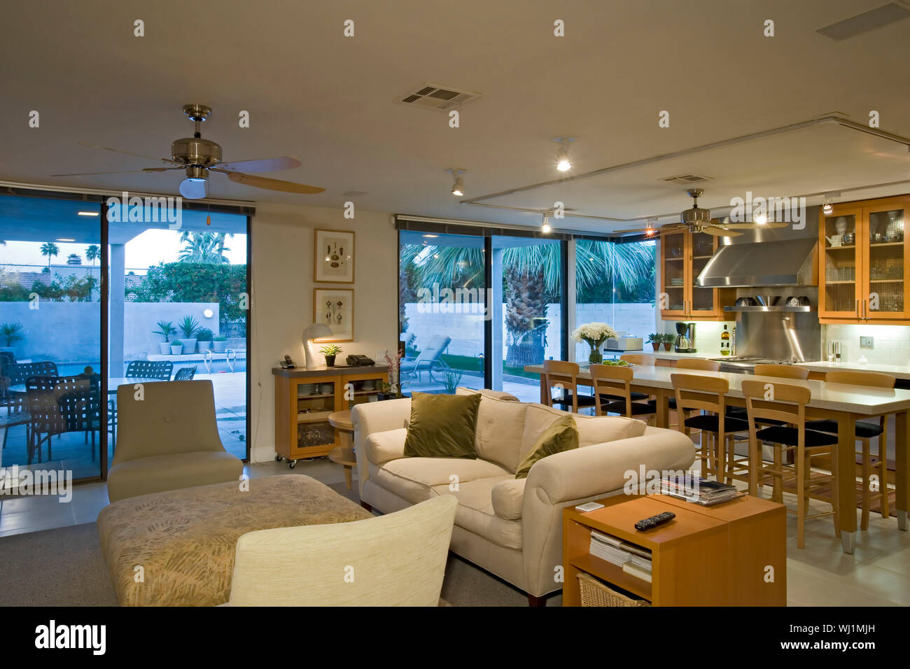 Living room with view of dining and kitchen in the background Stock Photo -  Alamy
