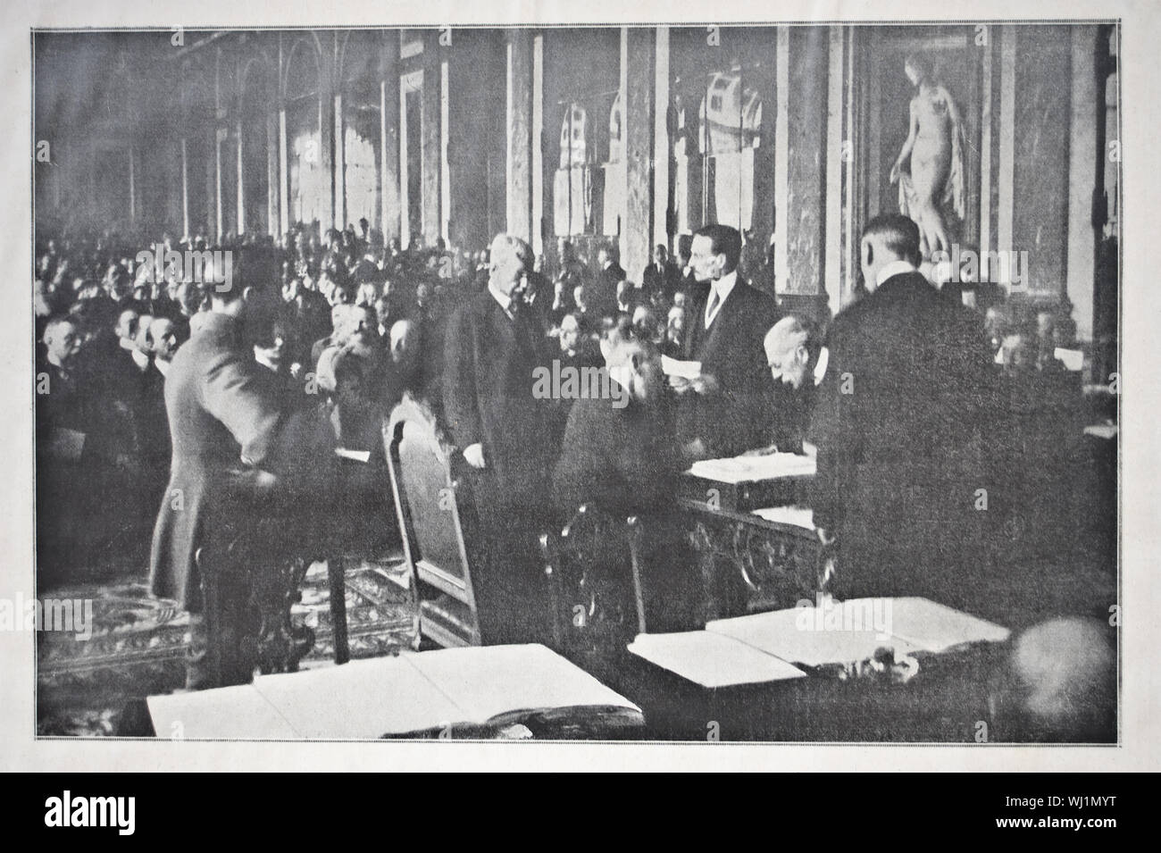 Newspaper photograph representing the US president Woodrow Wilson signing the Treaty of Versailles ( 1919). From the French newspaper 'L'illustration' Stock Photo