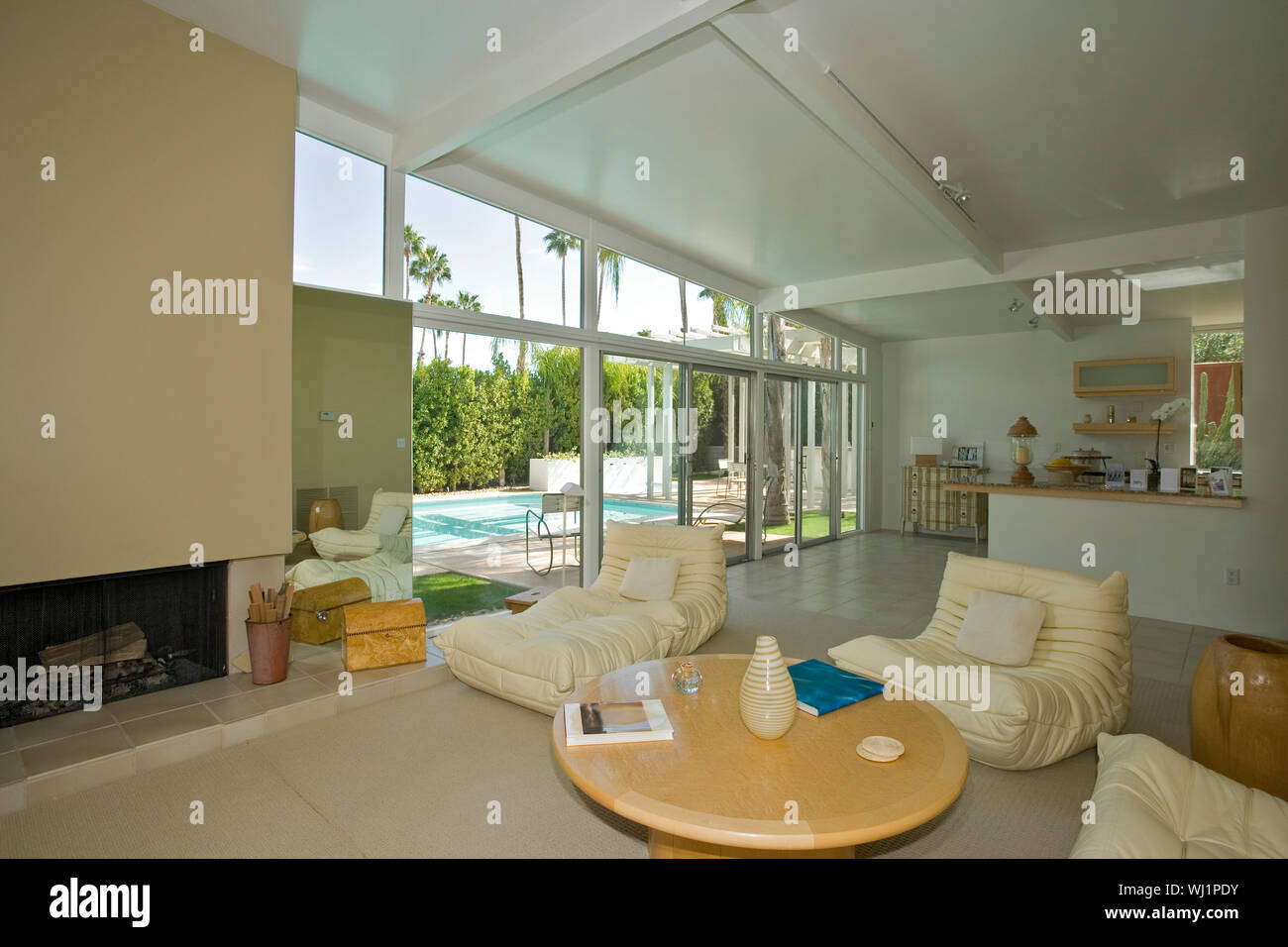 Spacious and luxury living room with view of swimming pool in a house ...