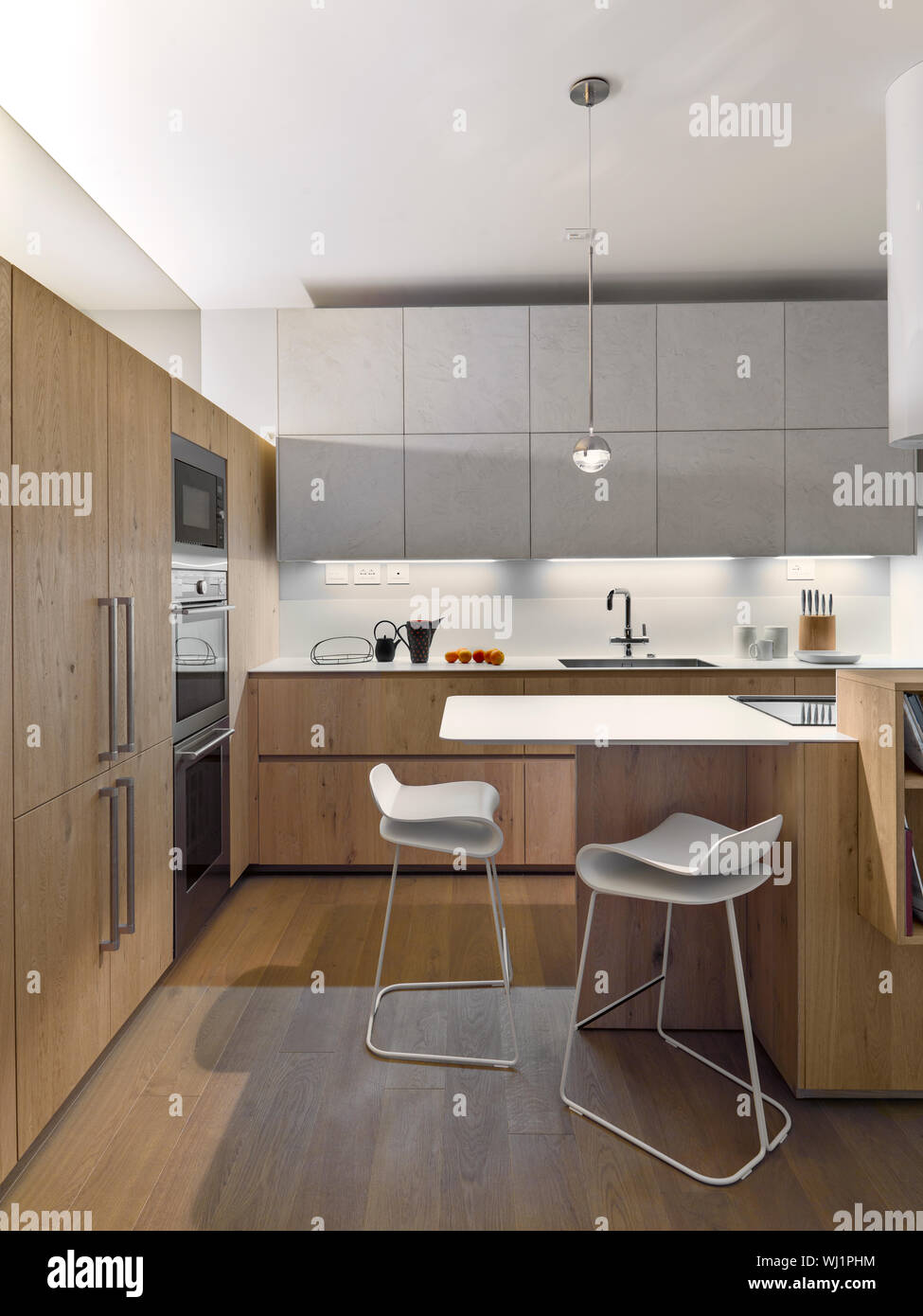 interiors shots of a modern wooden kitchen the floor is made of wood Stock Photo