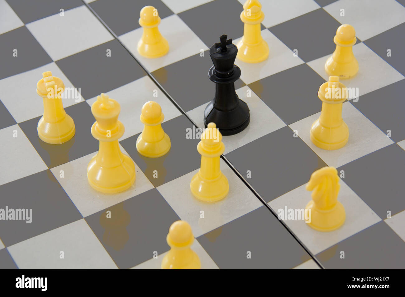 In chess, why are the black and white king / queens opposite each