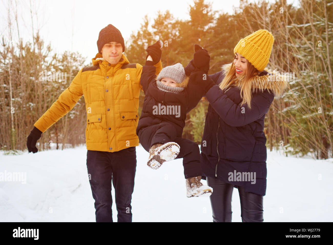 happy family walking in winter day. Family, weekend and holiday concept Stock Photo