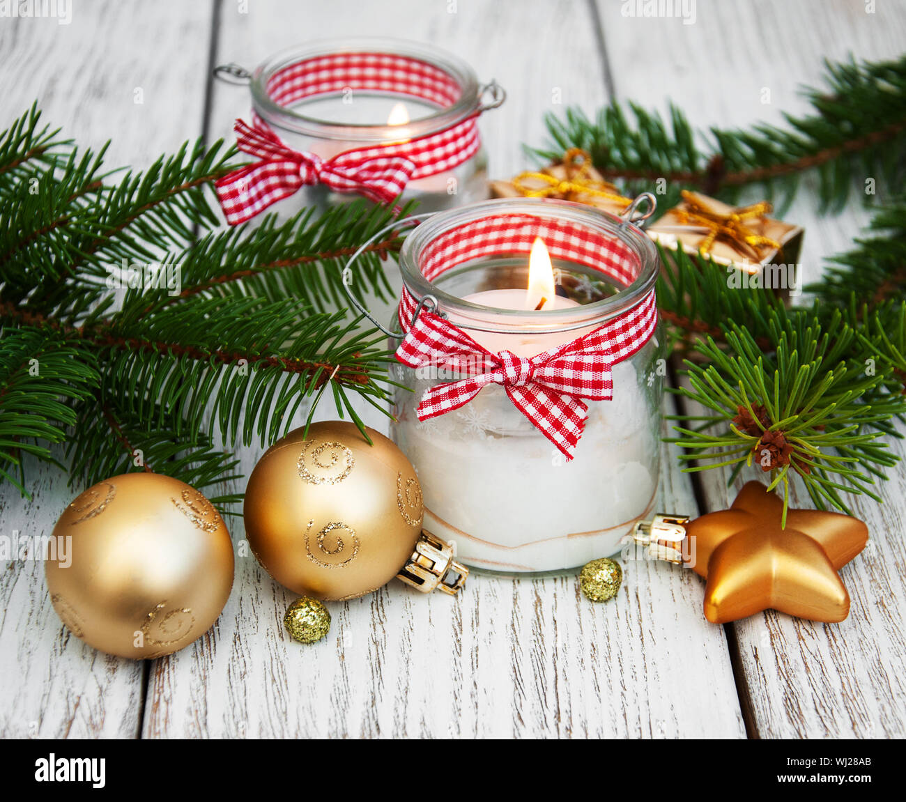 Christmas Decorations Candles In Glass Jars With Fir On A Old