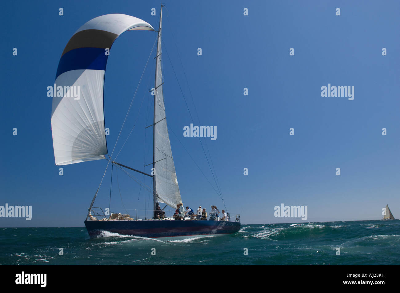 View of a yacht competing in team sailing event Stock Photo Alamy