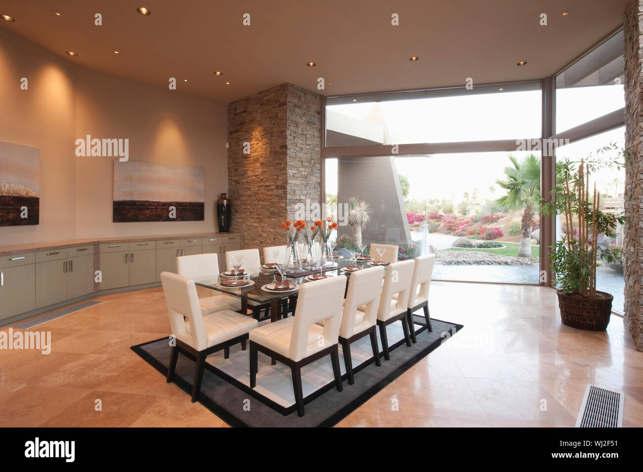 Spacious dining room with floor to ceiling windows Stock Photo - Alamy