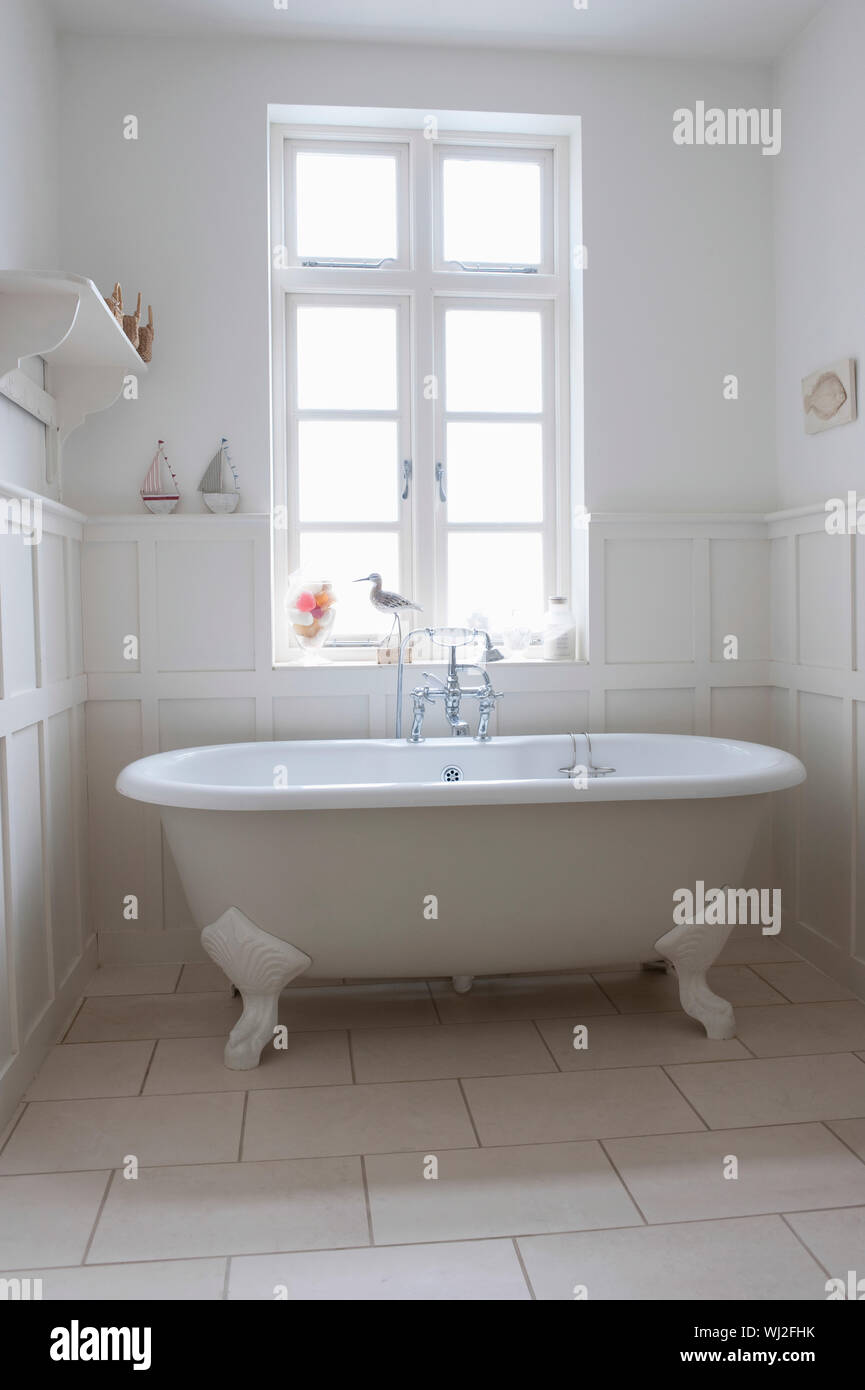 Freestanding bathtub in bathroom Stock Photo Alamy