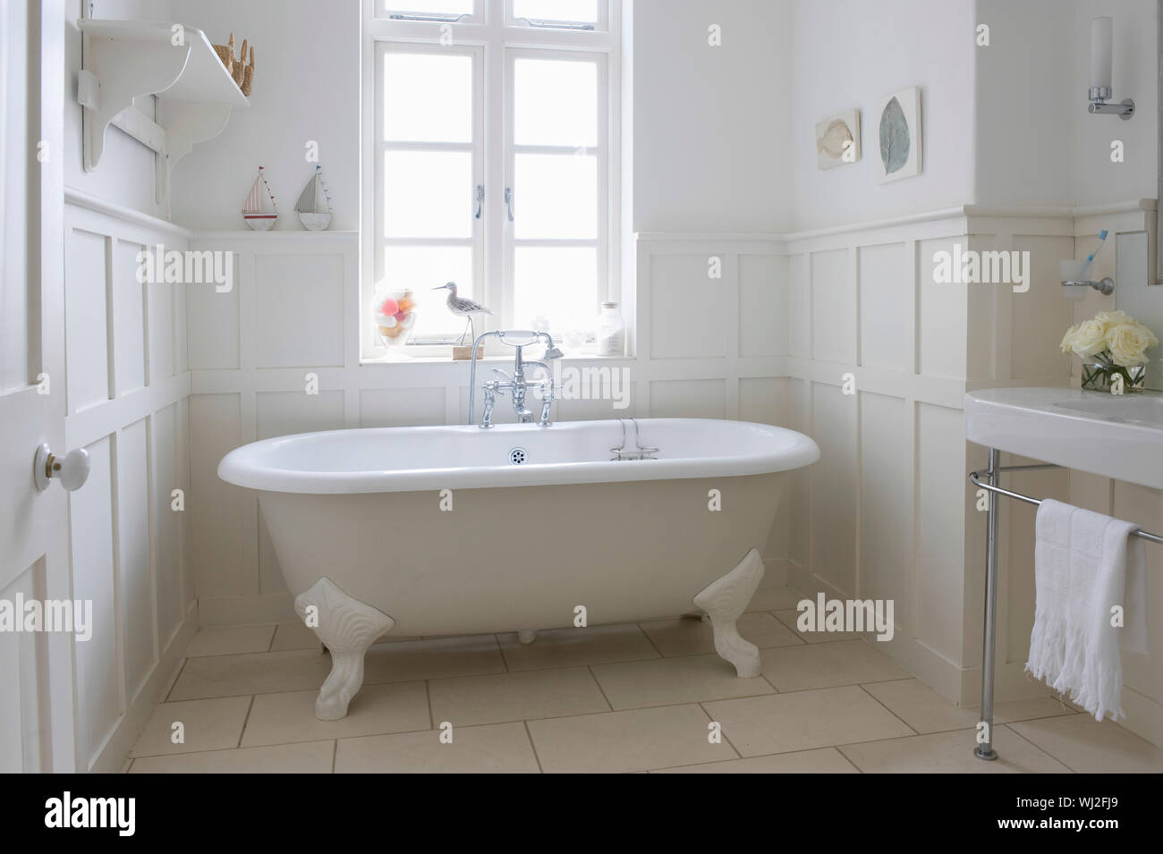 Freestanding bathtub in bathroom Stock Photo Alamy