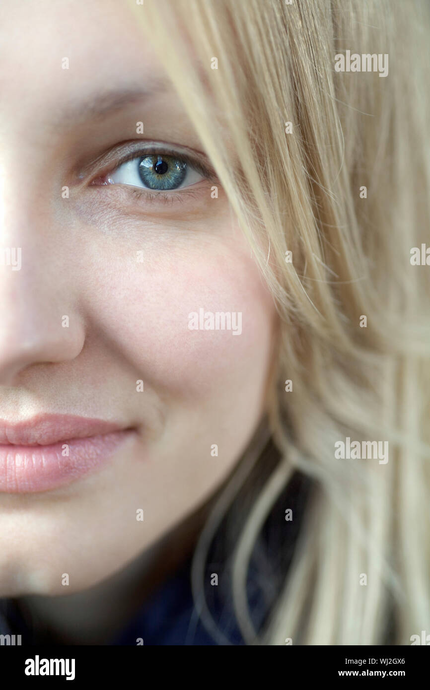 Closeup of portrait beautiful young woman with blue eyes Stock Photo ...