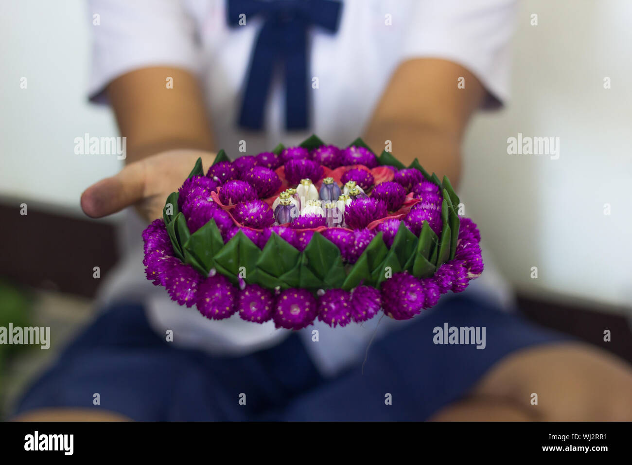 Midsection Of Woman Showing Flower Basket During Loi Krathong Stock Photo