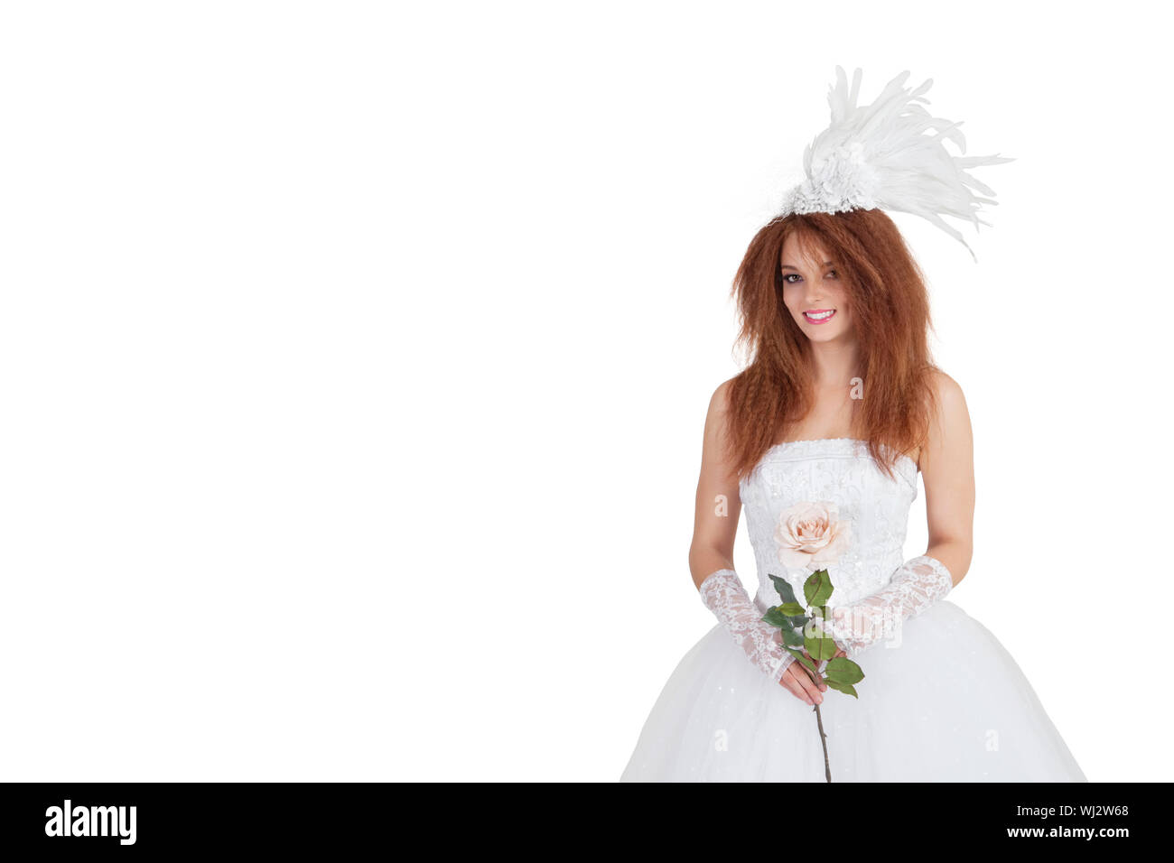 Portrait Of Elegant Brunette In Wedding Dress Holding Rose Over
