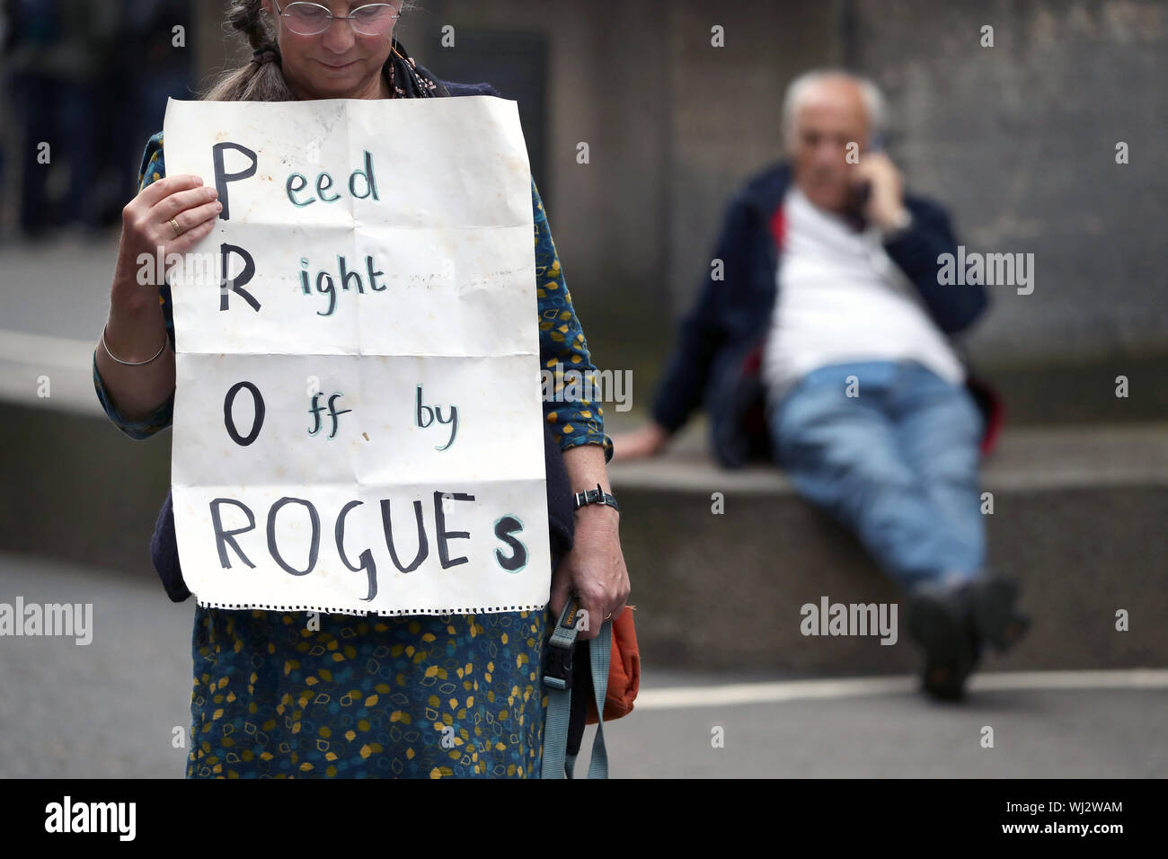 Pro-EU demonstrator holds up a home-made poster protesting against prorogation, outside the Court of Session in Edinburgh, where a full hearing will take place today for those seeking an interdict, through the Scottish legal system, to the royal order to suspend Parliament. Stock Photo