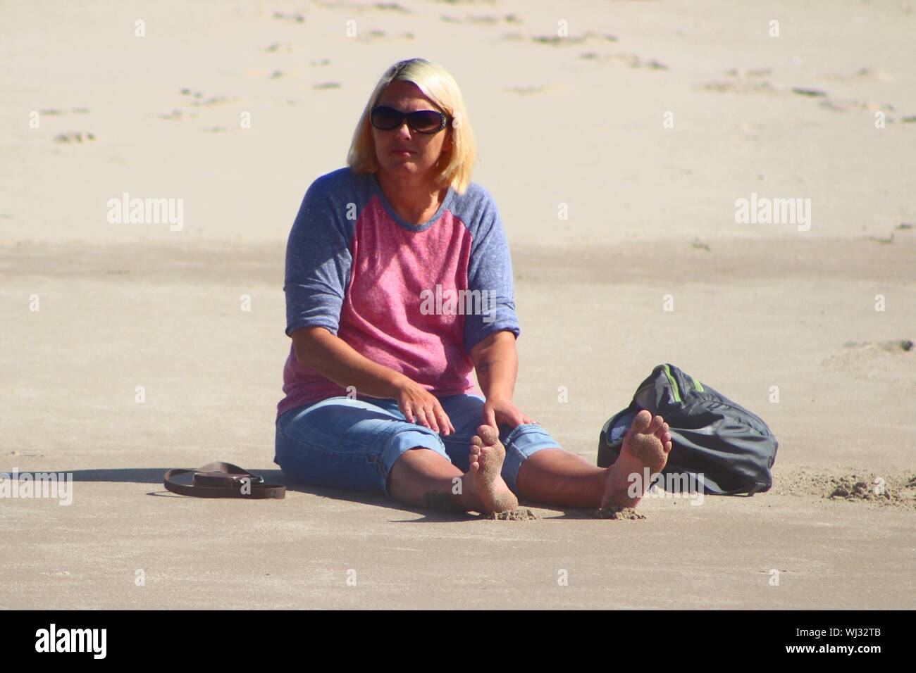Mature woman on beach summer hi-res stock photography and images - Alamy