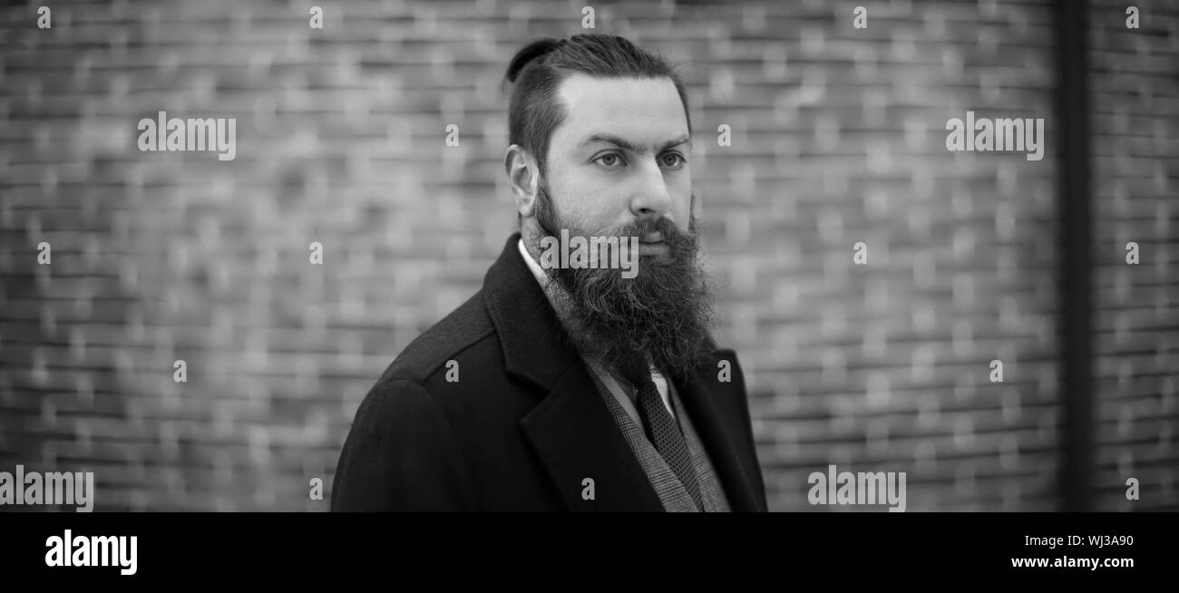man with a beard is a black and white photo Stock Photo