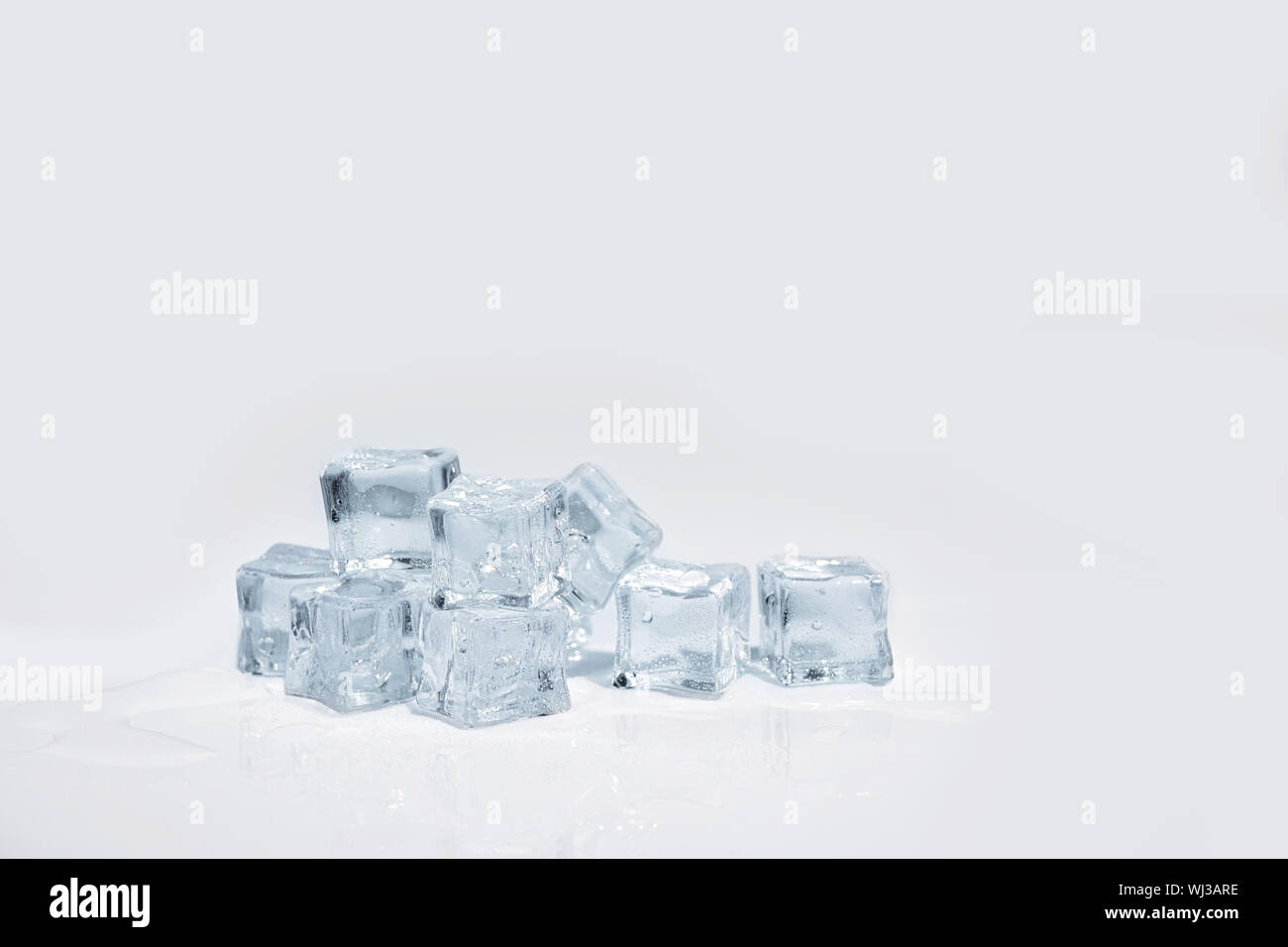 Ice cubes isolated on a white background Stock Photo - Alamy