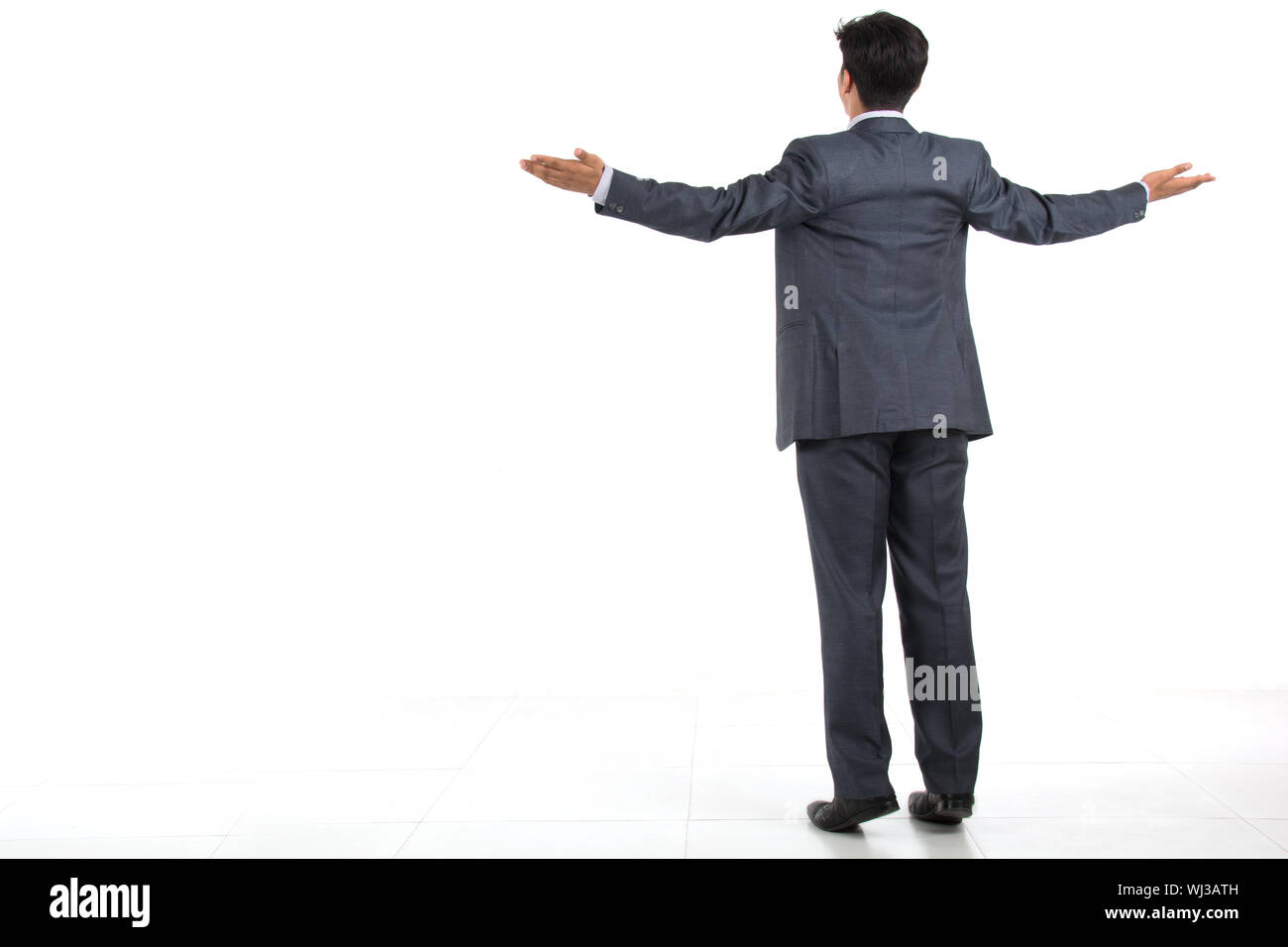 Black man arms outstretched suit hires stock photography and images