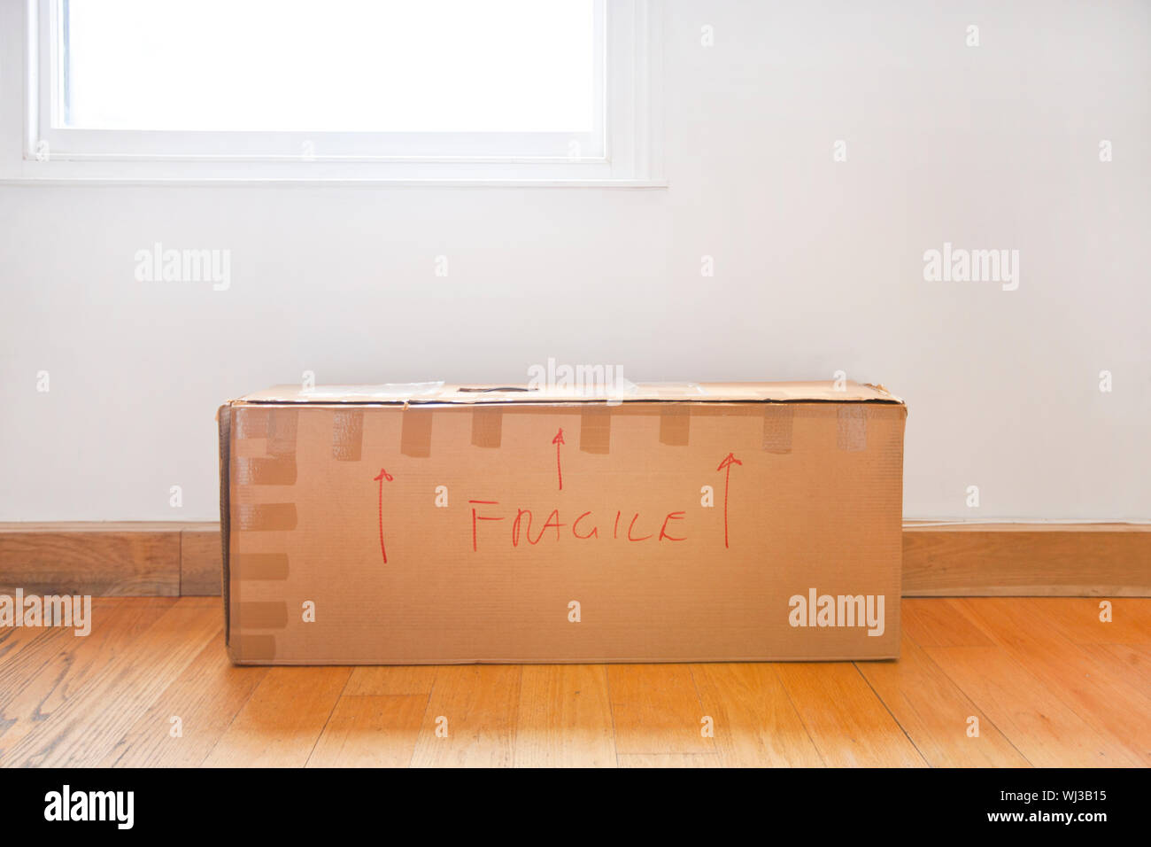 Cardboard box marked "fragile" Stock Photo