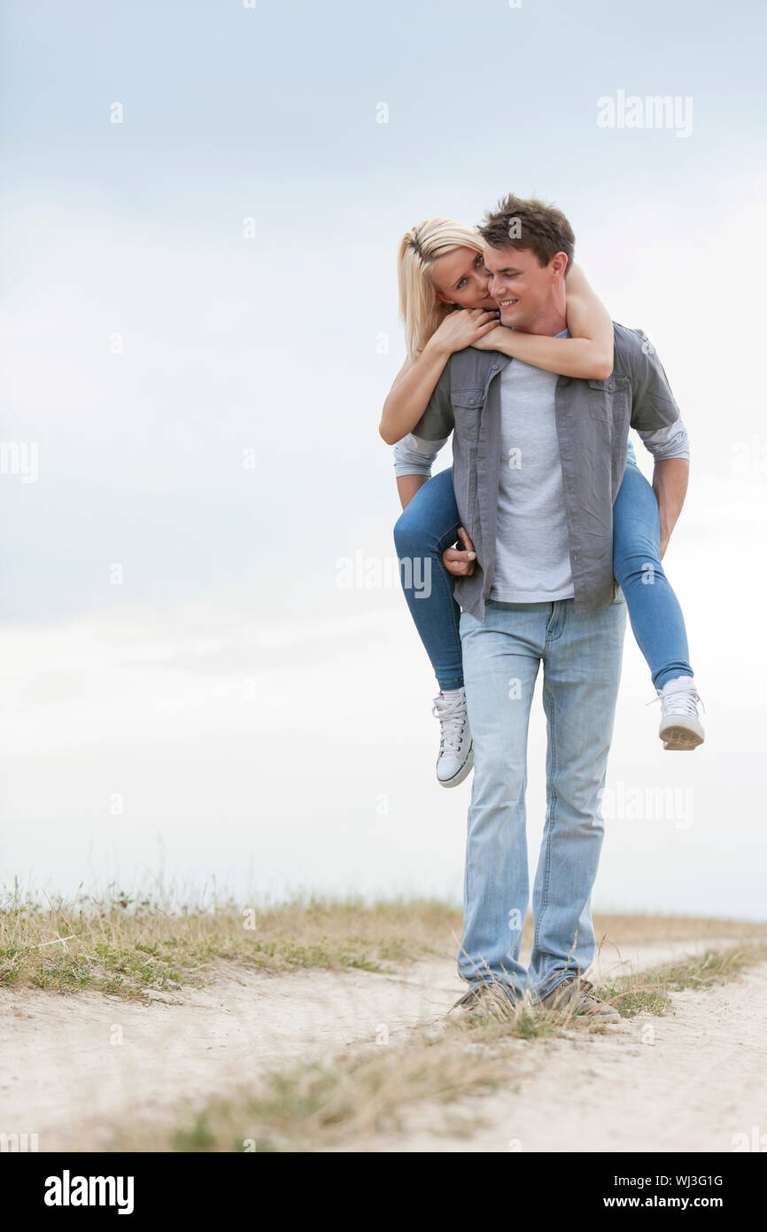 Midadult Caucasian Woman Giving Man Piggyback Stock Photo 3194063