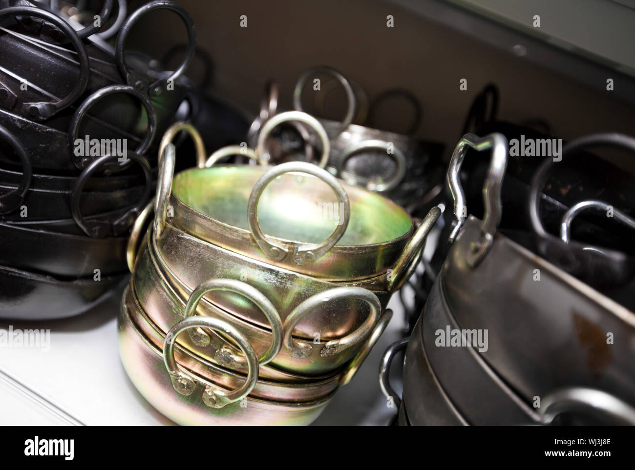 Stacked kitchen utensils in store Stock Photo Alamy