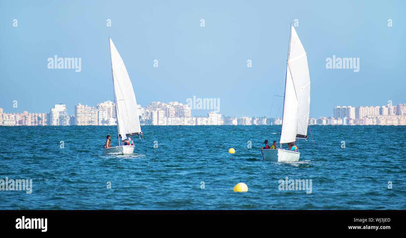 Barcelona, Spain, July 23, 2019 Group of people sailing in Spain