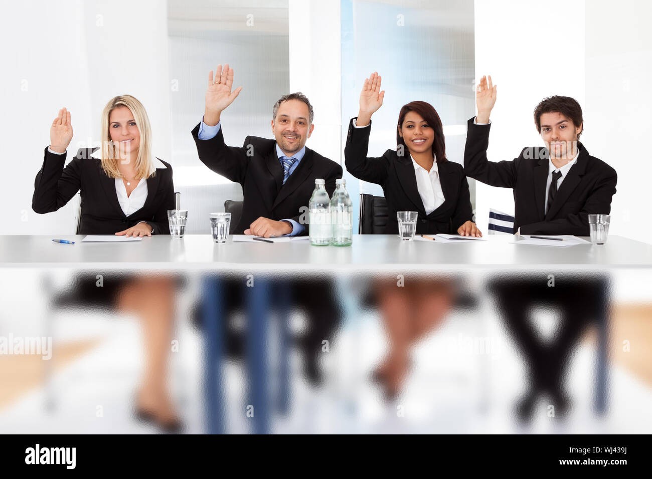 Group of business people voting at the meeting Stock Photo Alamy