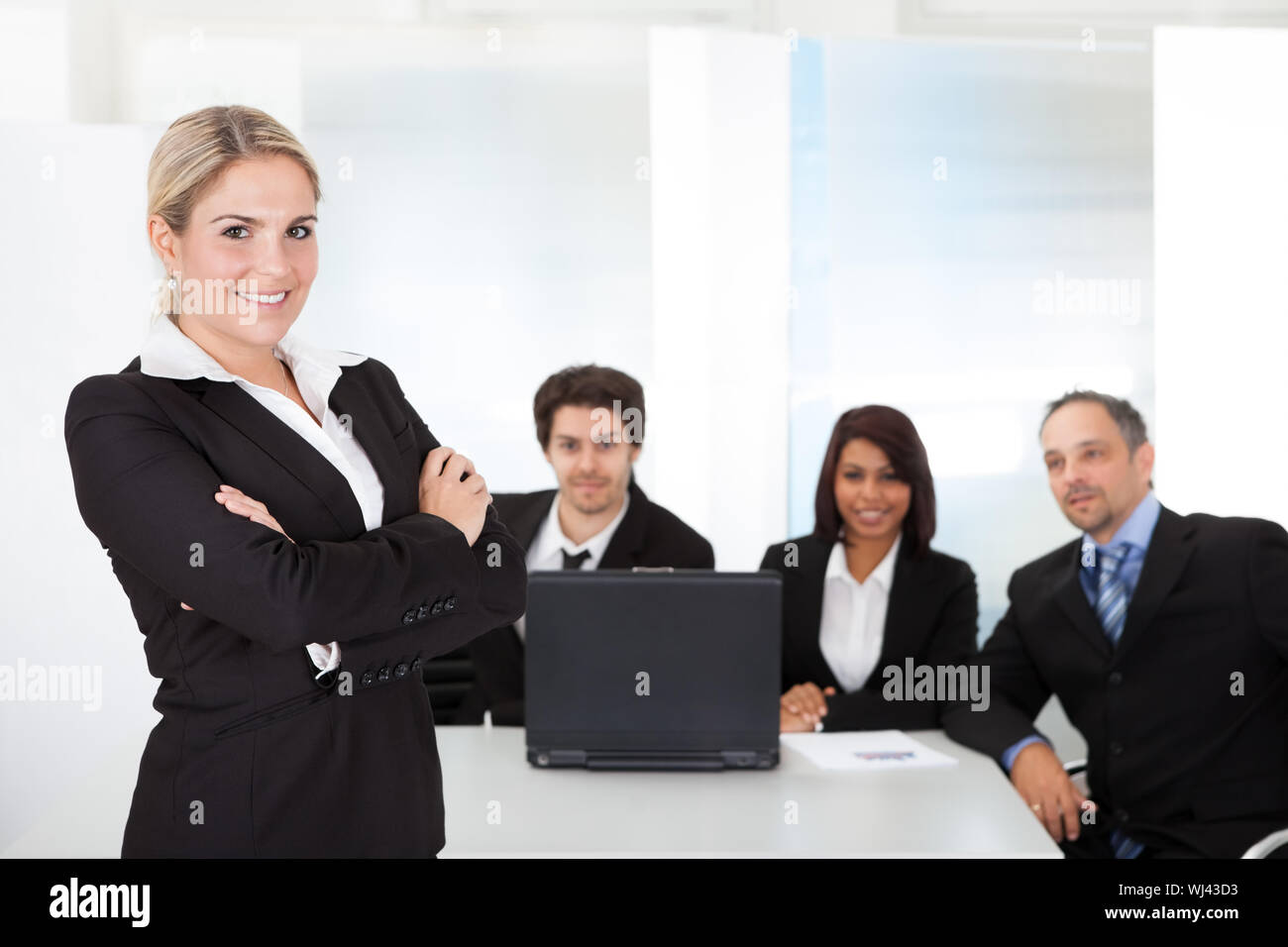 Portrait successful business woman and her team Stock Photo - Alamy