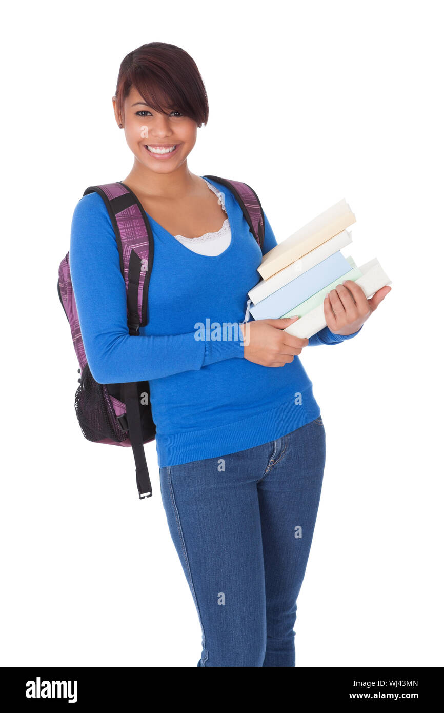 Portrait of beautiful student girl with books. Isolated on white Stock ...