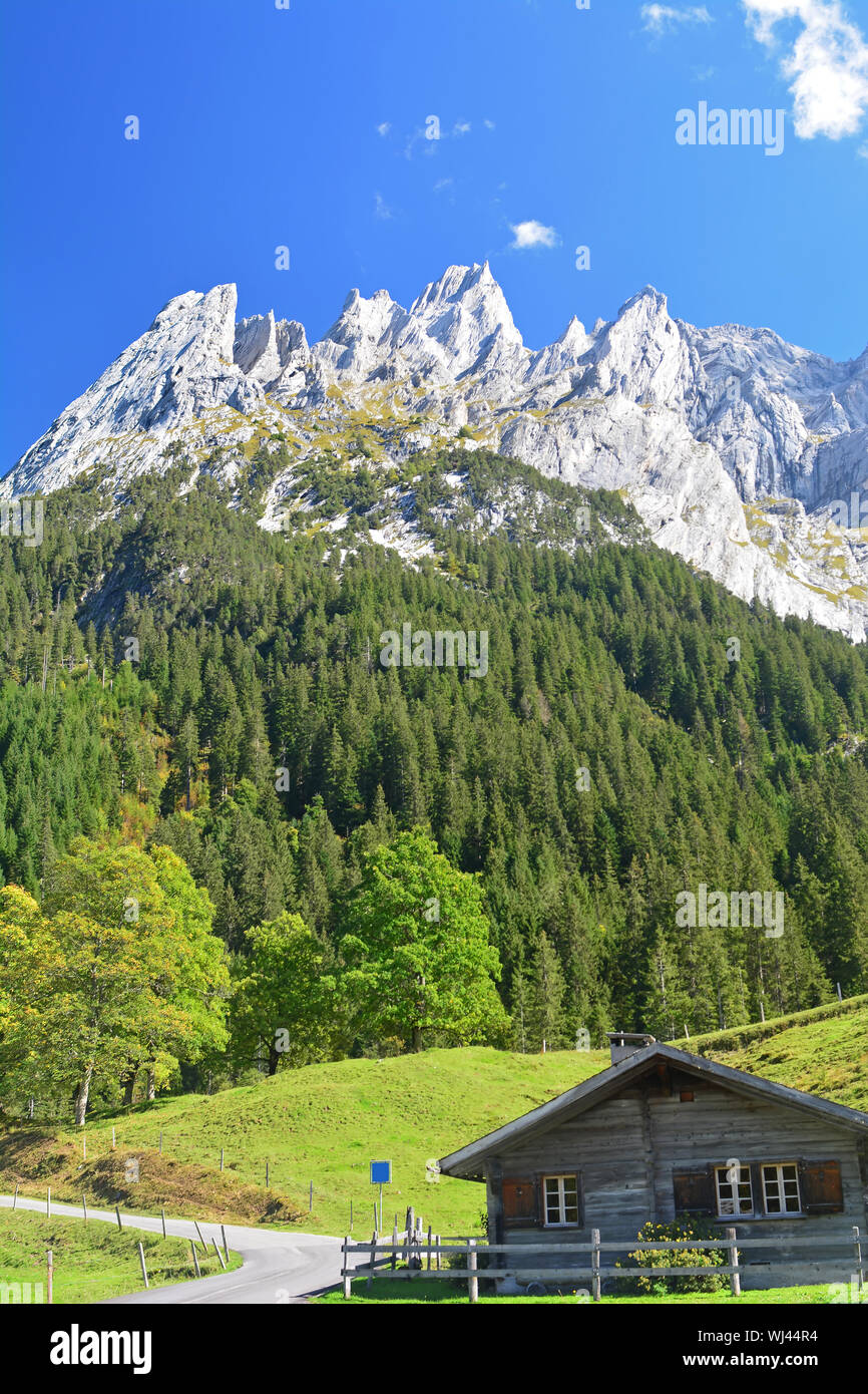 The Engelhorn mountains above Grindlewald in the Bernese Alps, Switzerland. With a swiss chalet in the foreground Stock Photo