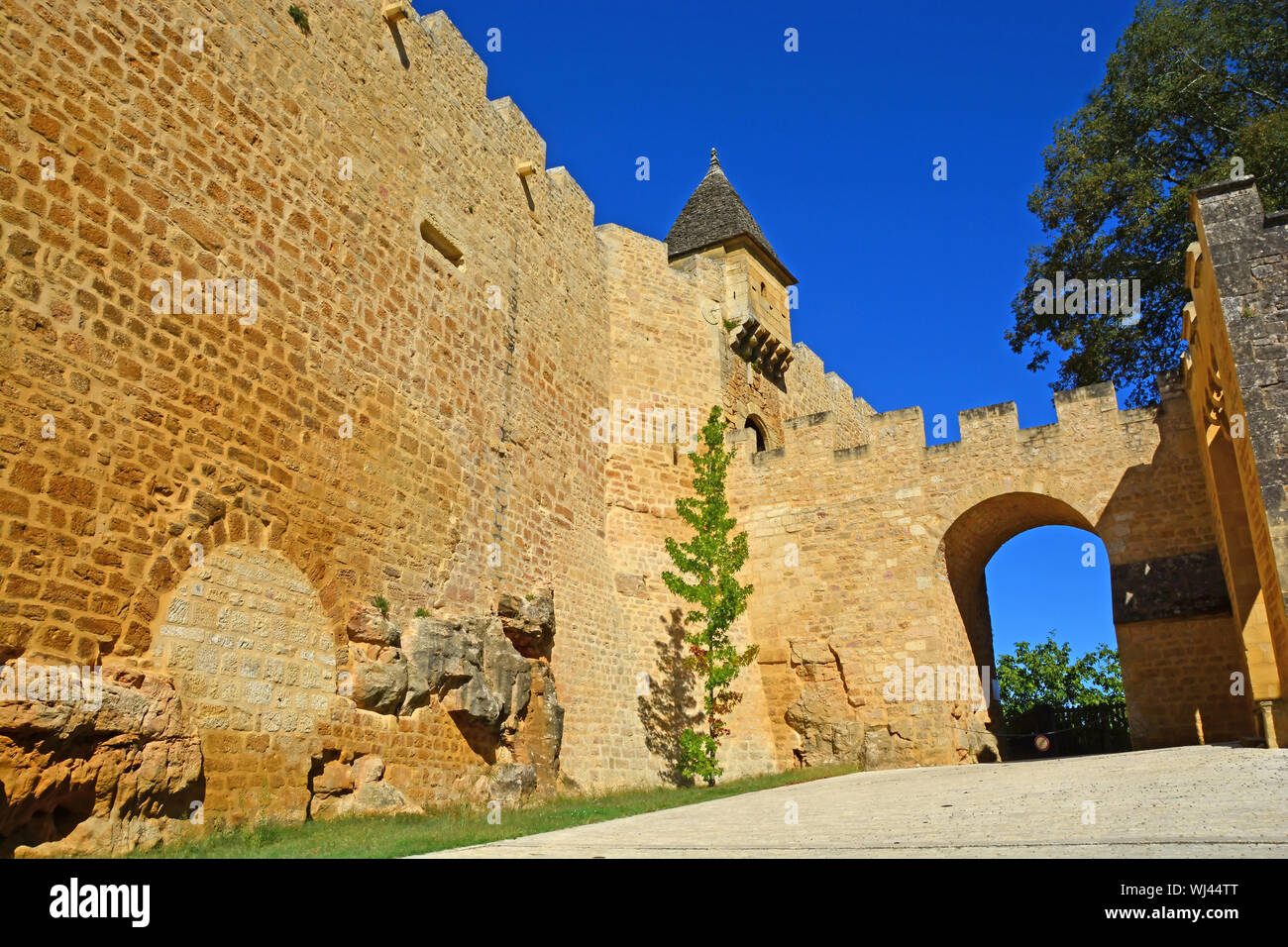 Entrance to the old, fortified Chateau Montfort on the Dordogne River in France Stock Photo