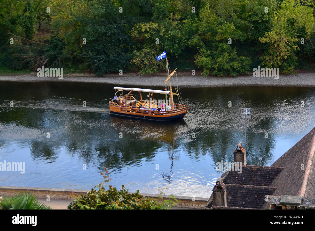 A traditional flat bottomed Scow, known locally as a Gabarre on the River Dordogne, France. Used for transporting tourists on the shallow river Stock Photo