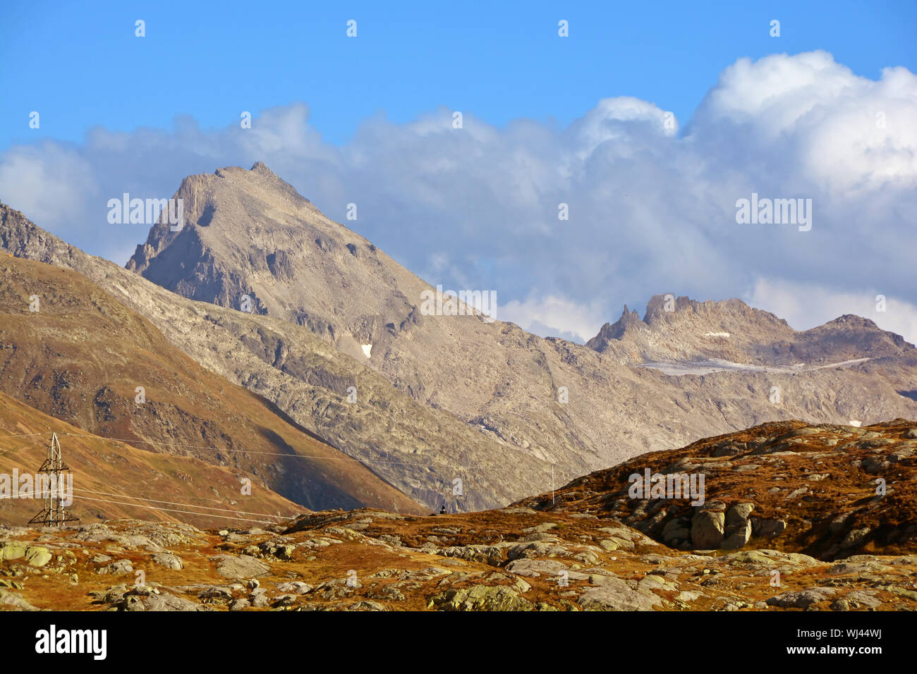 The Muttenhorner mountain (left of centre) seen from the Grimsel Pass in the Southern Swiss Alps Stock Photo