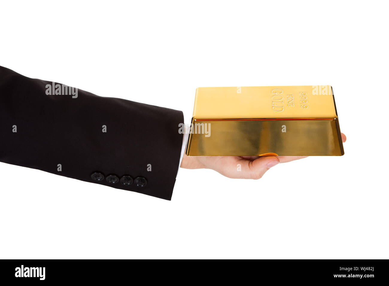 Cropped view of the arm of a businessman holding out a gold bar in a depiction of success and wealth isolated on white Stock Photo