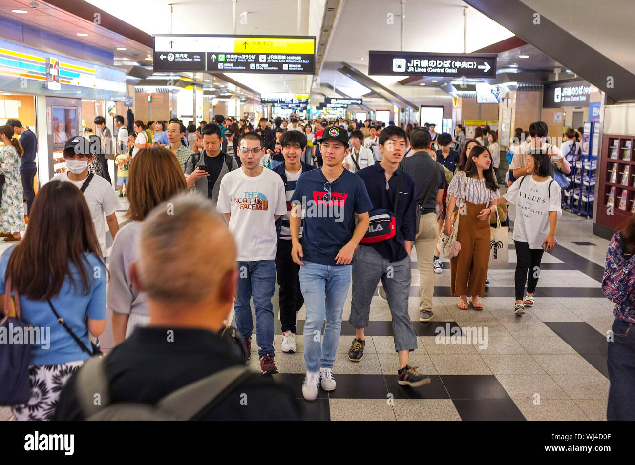 Crowd walking in the corridors of the Osaka train station in Osaka, Japan. Stock Photo