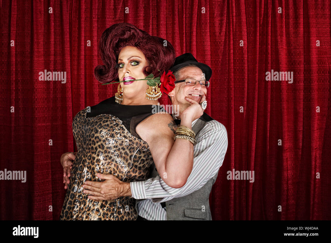 Happy man in drag with smiling businessman Stock Photo - Alamy