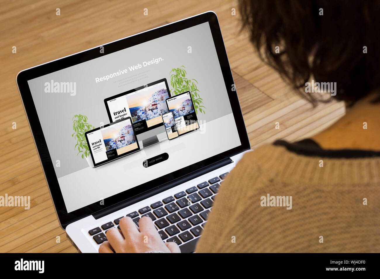 web design concept: responsive web design on a laptop screen. Screen graphics are made up. Stock Photo