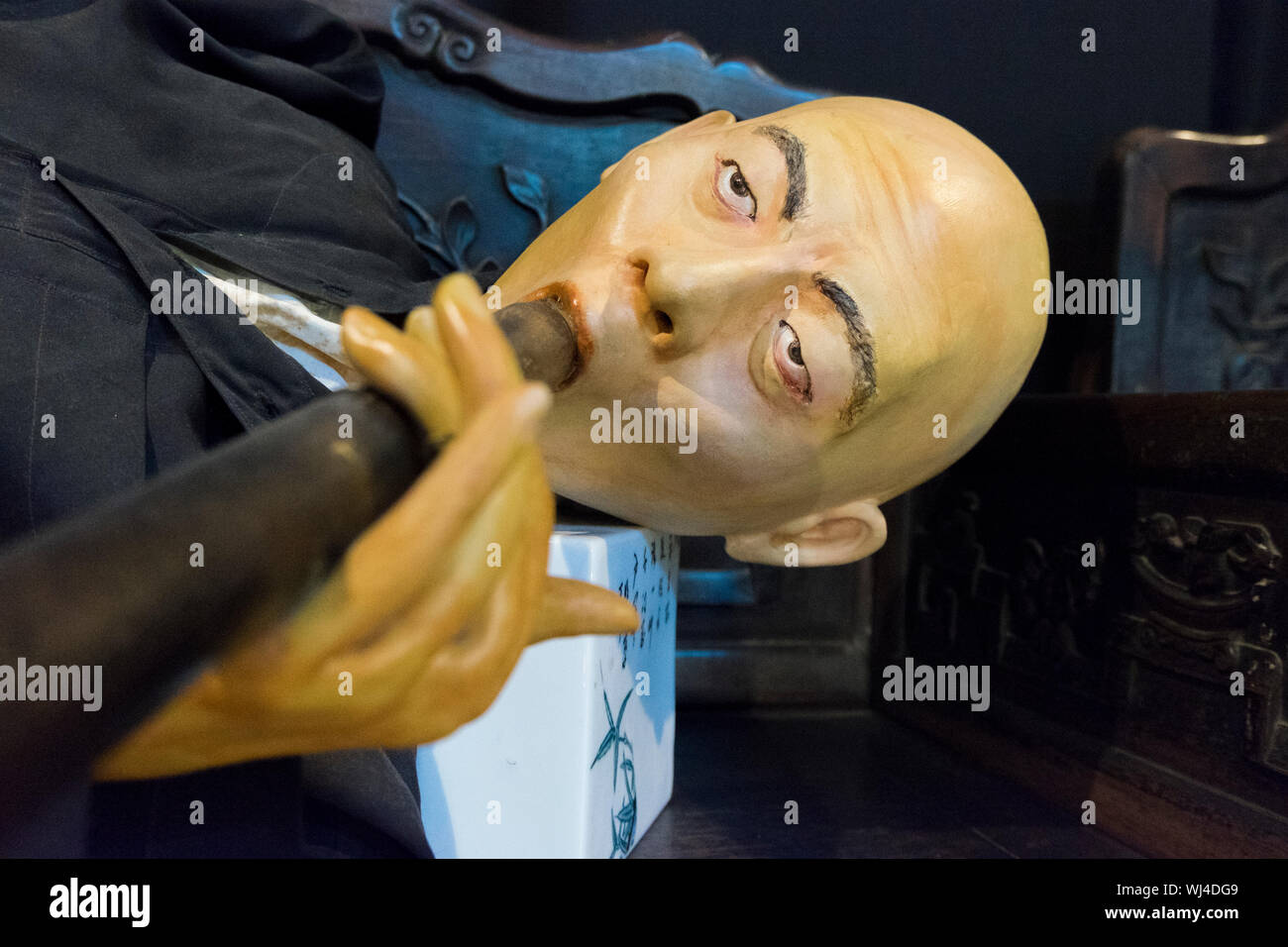 An exhibit showing Chinese opium smoking at the Hakka Tin Miners Club Museum shophouse in Ipoh, Malaysia. Stock Photo